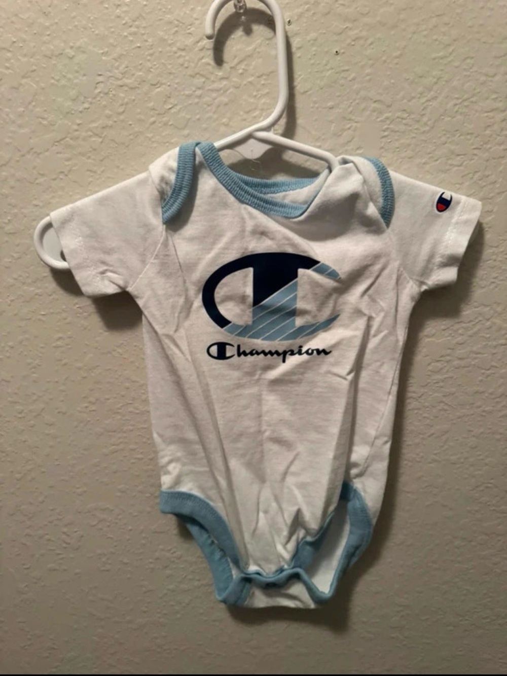 Champion White Baby One-Piece with Light Blue Trim and Navy Logo
